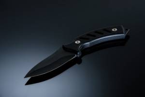 tactical folding knife on a table